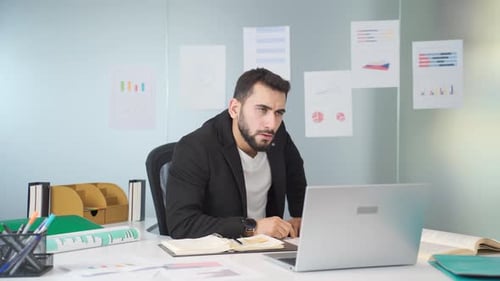 Frustrated businessman in his office.