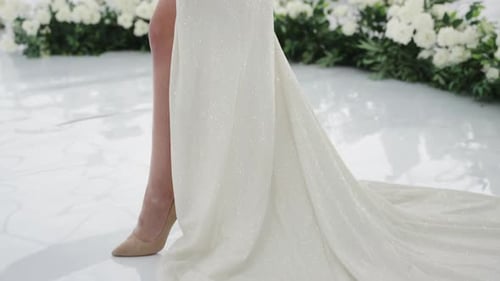 Beautiful Woman in White Wedding Gown Posing