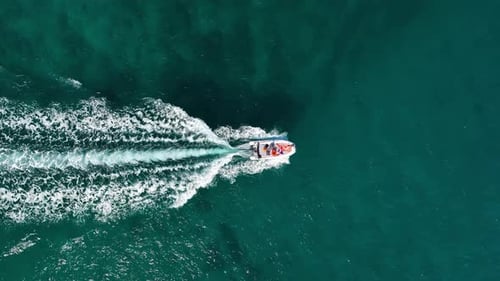Vacation and leisure. Aerial view on fast boat on blue Mediterranean sea at sunny day.