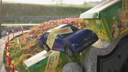 Paper Car Model at a Grave
