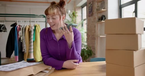 Female Entrepreneur Talking on Phone to Client in Fashion Vintage Store