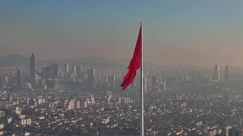 Aerial View of City with a Red Flag