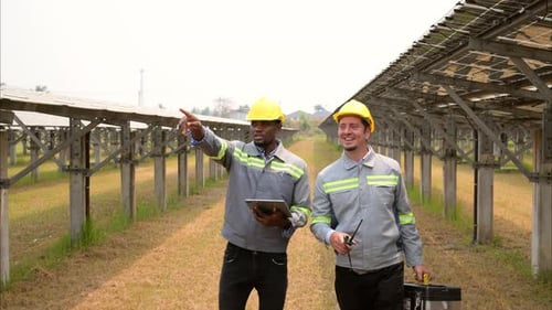 Professional Engineers Checking Security Protection System at Solar Power Plant