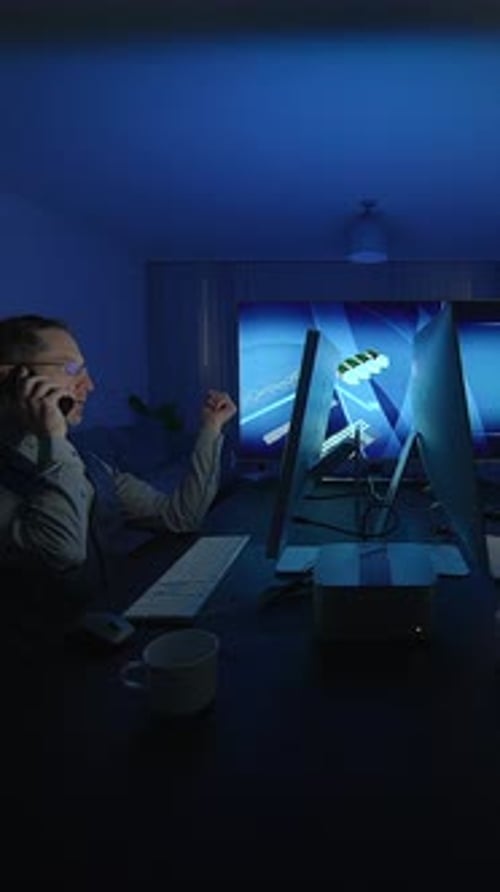 A Focused and Dedicated Professional Working Late at Their Computer in a Modern Office Environment
