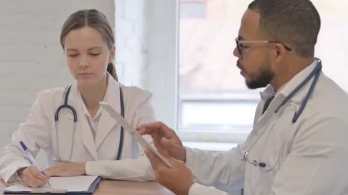 Team of Multi Ethnic Doctors Working Together in Hospital