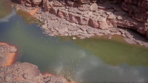 Colorado River Winding Through Rocky Terrain During Midday Sunlight