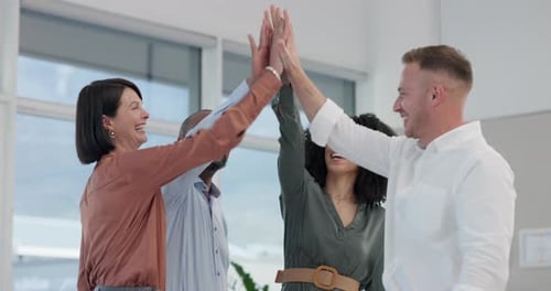 Diverse Team Celebrating Success With High Five