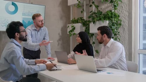 Diverse Team Discussing Business at Conference Table