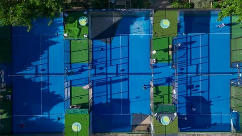 Aerial View Paddle Tennis Games Unfold on Scenic Courts By the Mediterranean Sea Blending Sports and