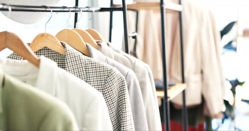 Fashion, clothing rack and empty boutique store for retail shopping, accessory or outfit choice