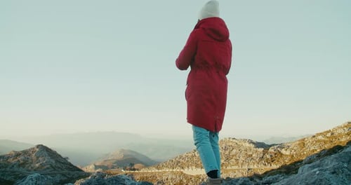 Inspired Travel Female Photographer on Mountain Top Take Picture on Road Trip