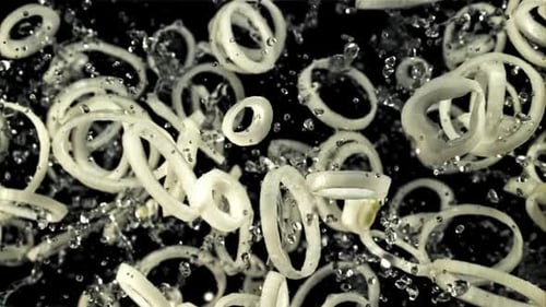 Falling Onion Rings With Water Splashes
