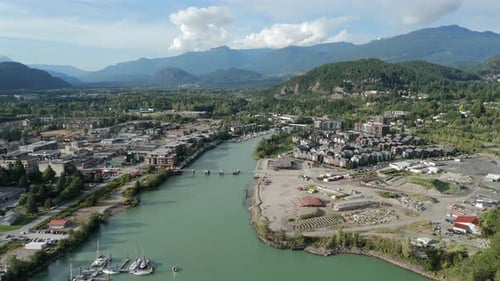 Stunning Mountain Town Valley Aerial River and Coastal City Drone View