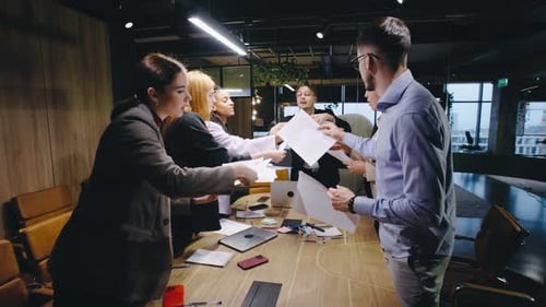 Business Team Collaborating on Project in Modern Office