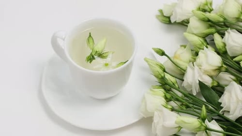 Elegant White Tea and Lisianthus Still Life