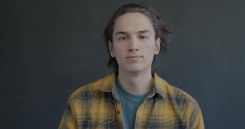 Young Adult Giving Thumbs Up in Studio
