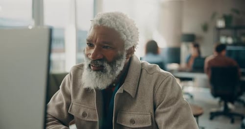 Happy, man and reading on computer in office for research, review article and editing draft