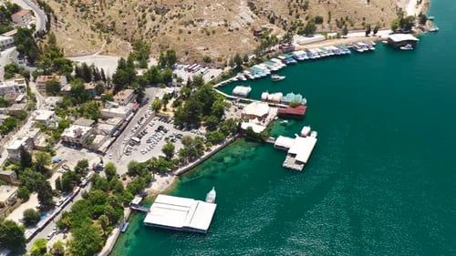 Aerial Video of Bright Day on River with Boats Near the Shore