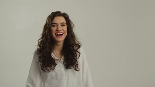 Happy Woman Gesturing and Smiling