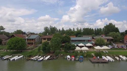Boats And Houses At River Bank