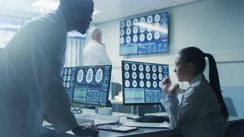 Doctors Examine Brain Scans in Modern Office