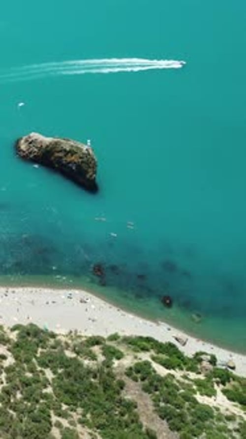 Aerial View on Summer Beach Swimming People in Sea Bay with Transparent Blue Water and Volcanic