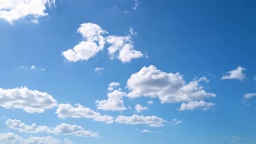 White Clouds Drifting Slowly Across a Blue Sky