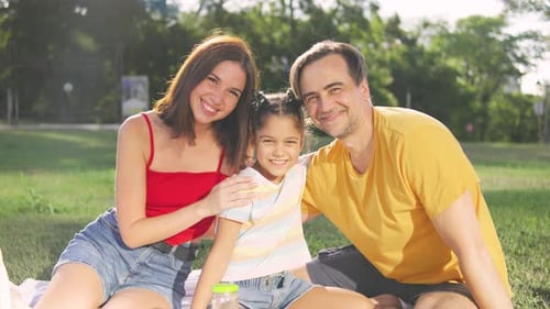 Happy Family Enjoying a Picnic in the Park