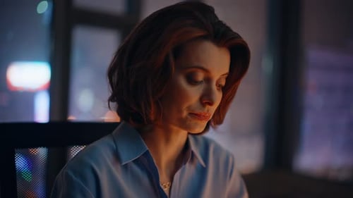 Closeup Thoughtful Overtime Manager Pondering Business Strategy at Dark Office