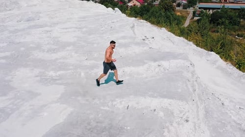 Aerial view of a muscular sexy man. Bodybuilding and outdoor sports concept