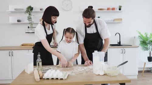 Happy Family Baking Together in the Kitchen