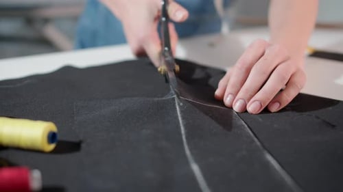 Close Up of Fabric Being Cut with Scissors