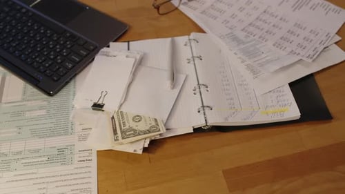 Office Desk with Documents and US Currency