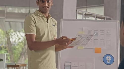 UX Designer Presenting Project to Team