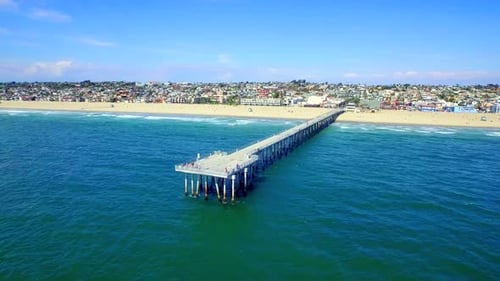 Pier Over Blue Water by Aerial Drone Aerial