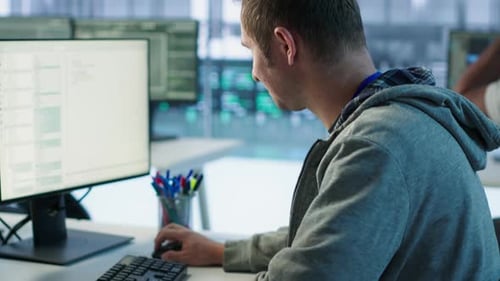 System Administrator in Server Room Doing System Analysis Coding