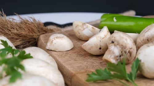Fresh Mushrooms and Vegetables on Cutting Board