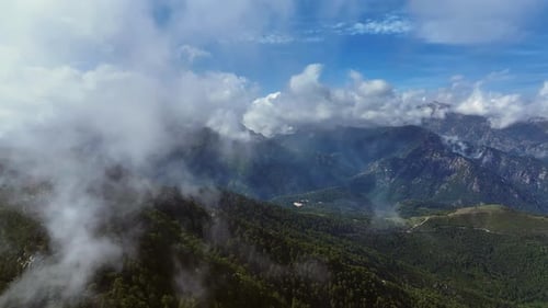 Lush Green Mountains Aerial View with Clouds