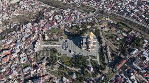 Aerial view of Holy Trinity Cathedral Sameba in Tbilisi Georgia. Sunrise drone footage.