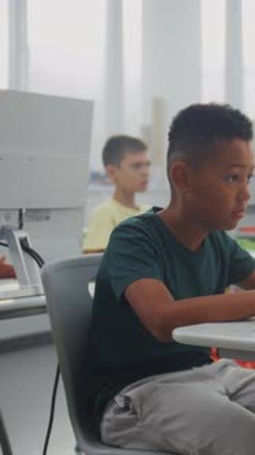 Elementary School Children Using Computers Doing Creative 3D Design Projects