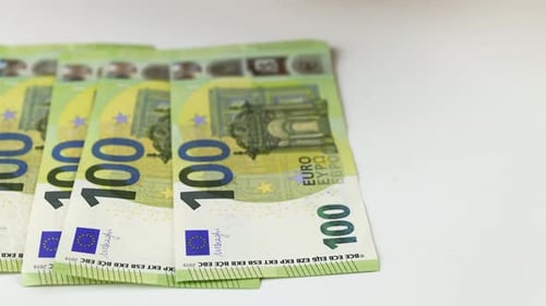 Stacking Euro Notes on White Surface