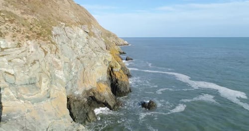 The perfect view of an edge of a cliff in this fly by shot that contains the tranquility of the soft