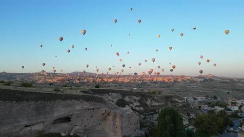 Cappadocia Balloons Fly Over The Surreal Landscape at Sunrise