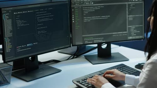 Computer Scientist in Data Center Monitoring Security Threats Using Computer