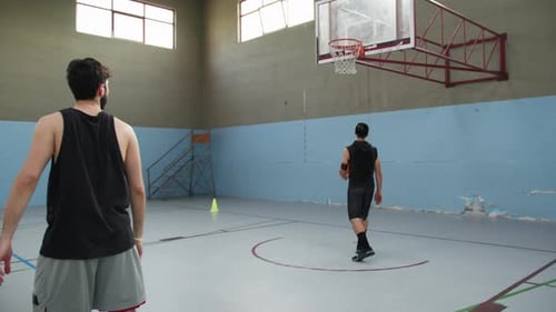 Basketball Players Train In The Indoor Court Before The Match