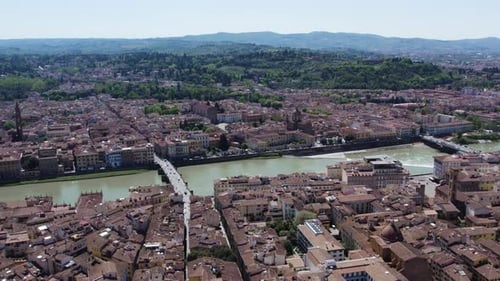 Beautiful drone cityscape of Florence, Italy. Historic buildings on the river Arno, summer sunny day
