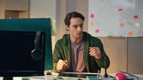 Relaxed Specialist Greeting Display Computer At Video Call At Work Place. Close Up Skilful Guy Wa...