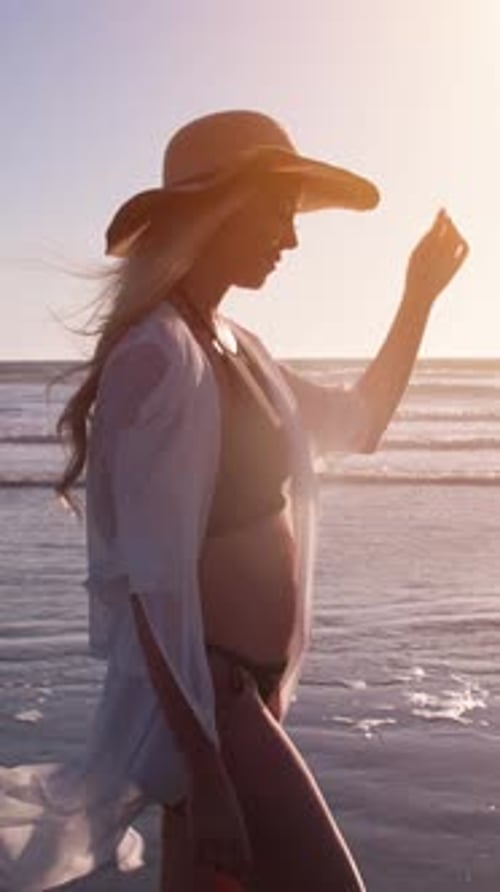 Attractive Blond Woman Walking on the Beach. Vertical Video.
