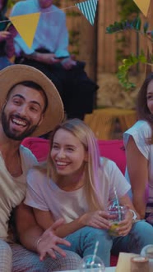 Young Adults Laughing Together at Outdoor Party