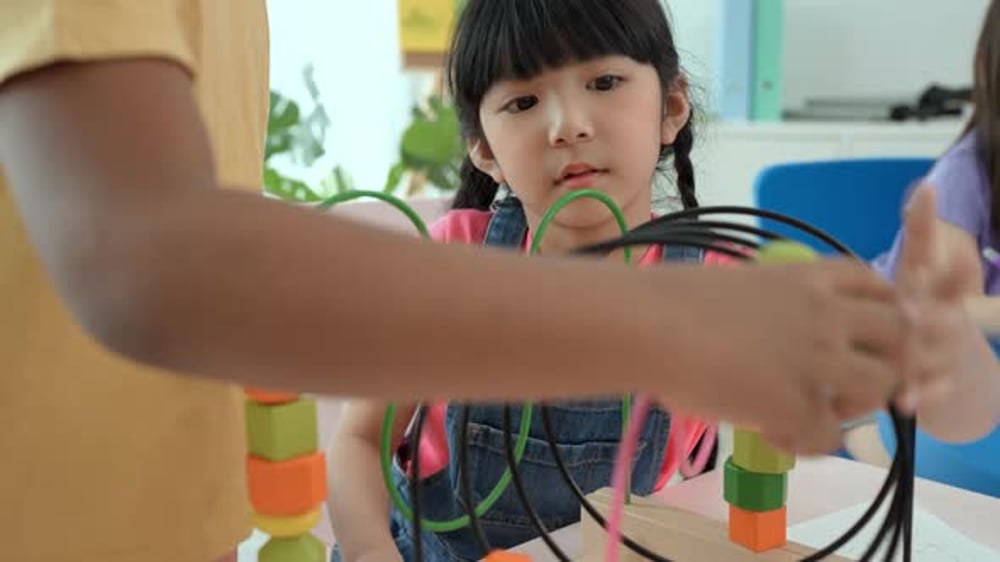 Happy two children playing with puzzle. Educational toys for preschool ...